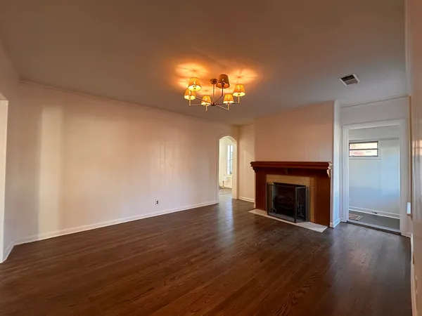 a view of a hallway with a wooden floor