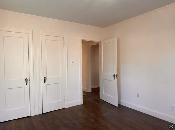 an empty room with wooden floor