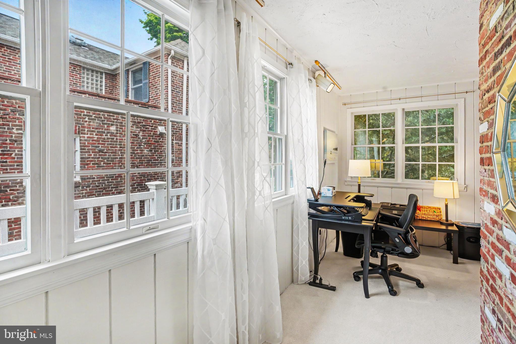 235 Hopkins Road Haddonfield, NJ 08033 - Photo 19 of 47 a view of a workspace with furniture and a window