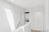 a bathroom with a tub and a shower