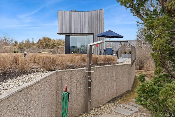 a bathroom with a shower and a mirror