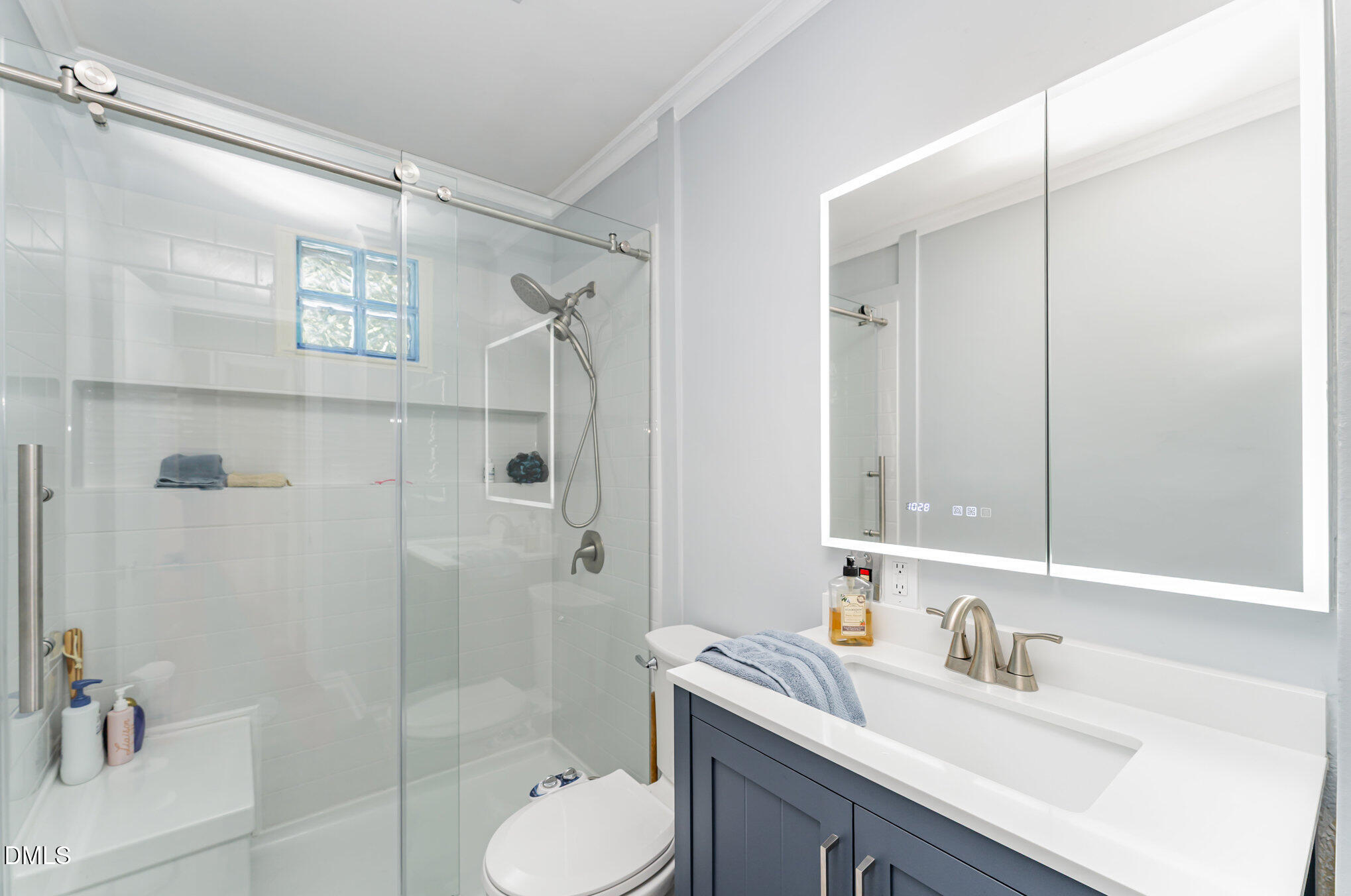120 Blanchard Street Raleigh, NC 27603 - Photo 12 of 23 a bathroom with a sink toilet tub and shower