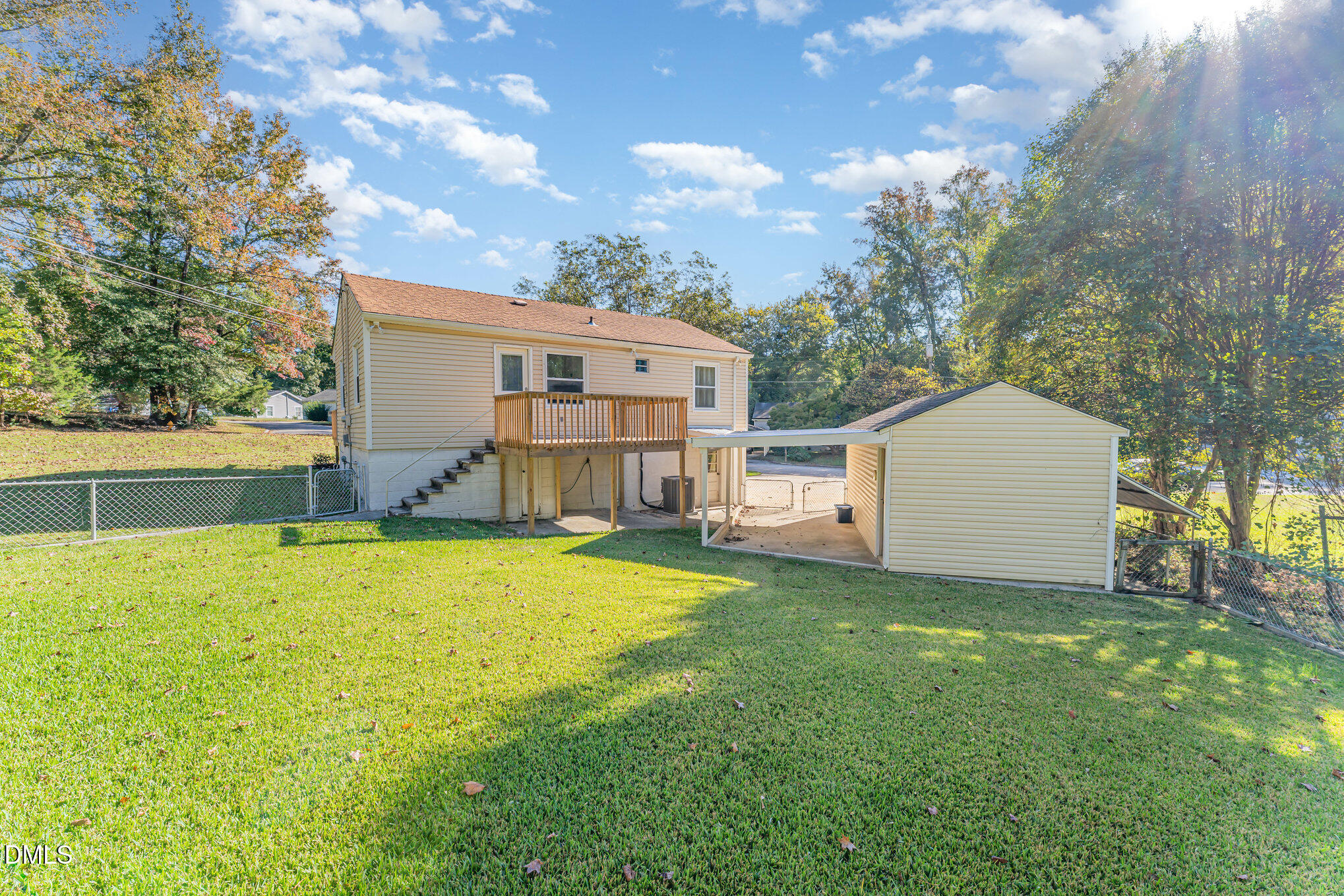 120 Blanchard Street Raleigh, NC 27603 - Photo 17 of 23 a view of a backyard with a garden and tree