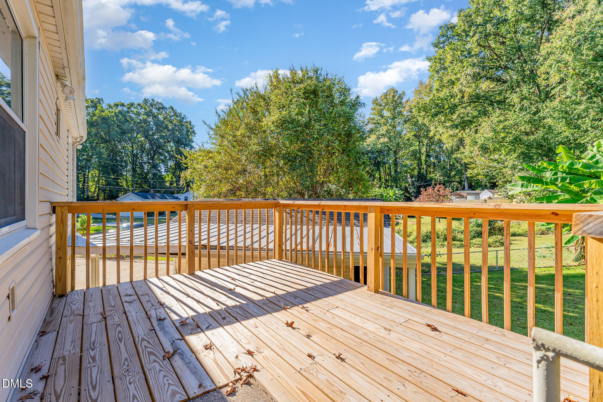 120 Blanchard Street Raleigh, NC 27603 - Photo 18 of 23 a balcony with wooden floor and fence