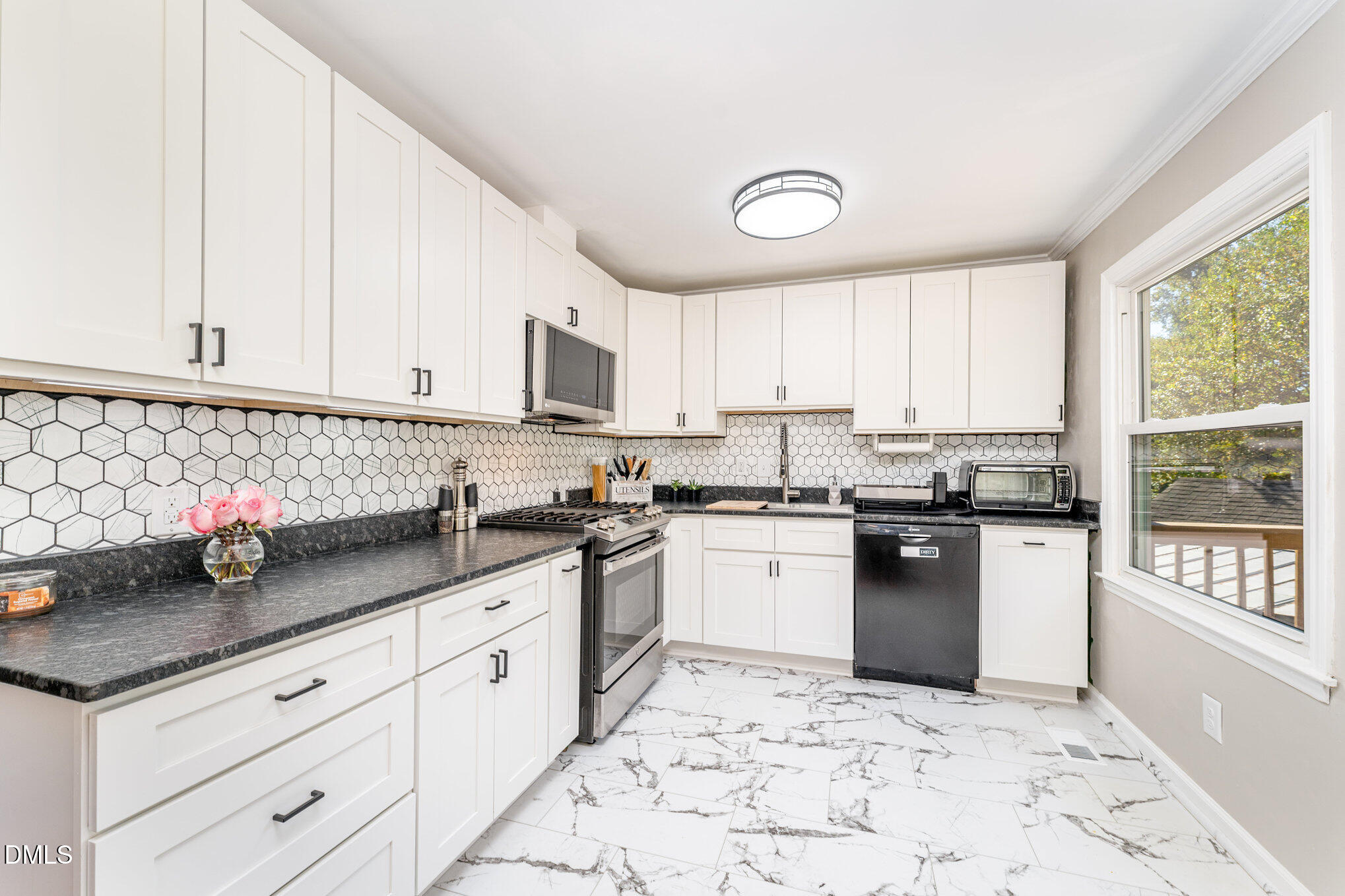 120 Blanchard Street Raleigh, NC 27603 - Photo 6 of 23 a kitchen with granite countertop white cabinets and white appliances