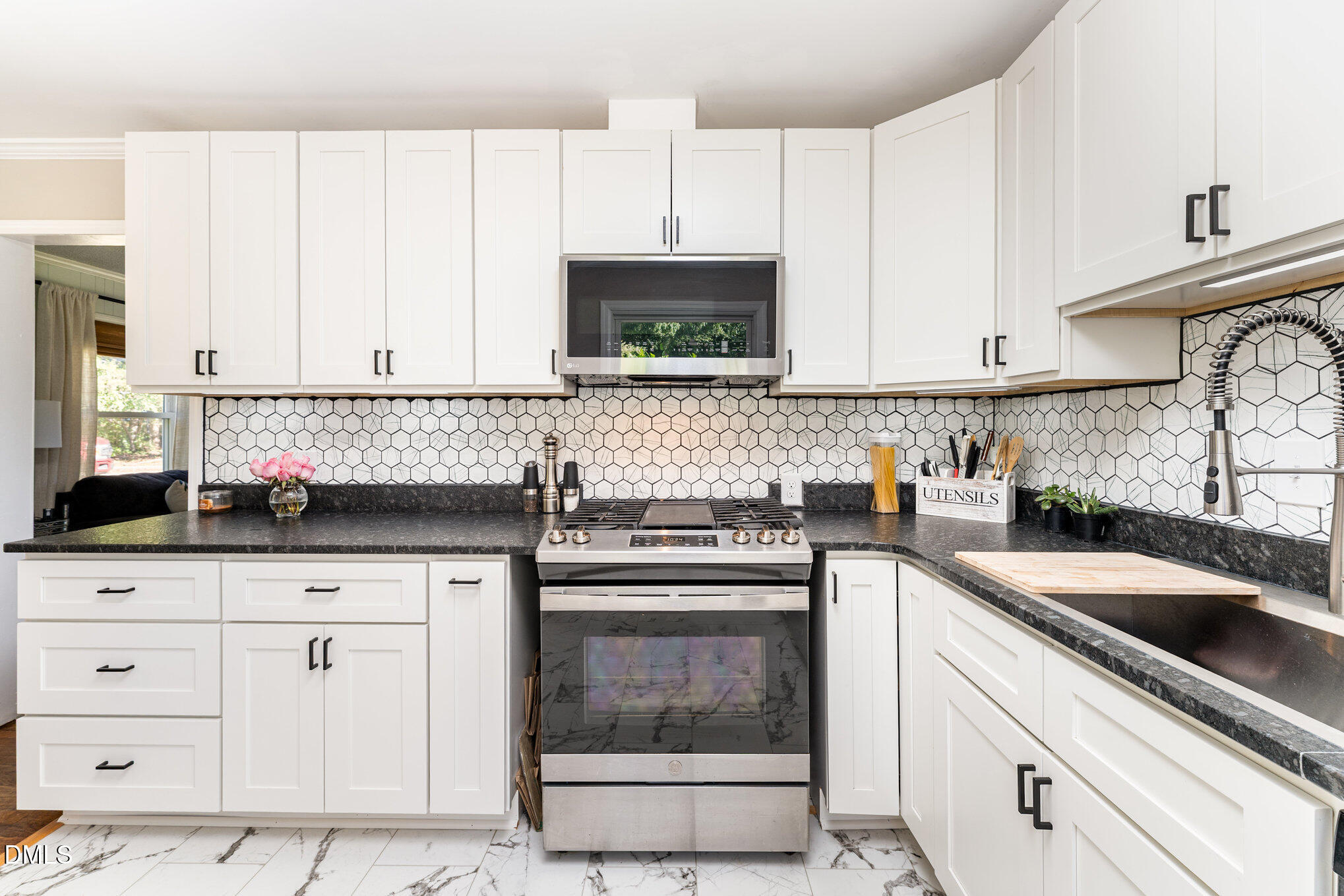 120 Blanchard Street Raleigh, NC 27603 - Photo 7 of 23 a kitchen with granite countertop a sink and a stove