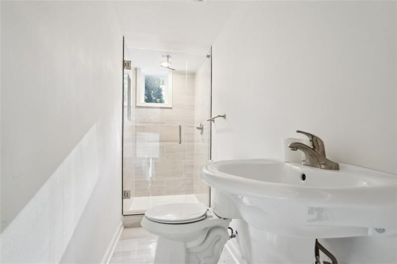 2533 Kelly Lake Road Decatur, GA 30032 - Photo 5 of 14 a bathroom with a sink a toilet and shower