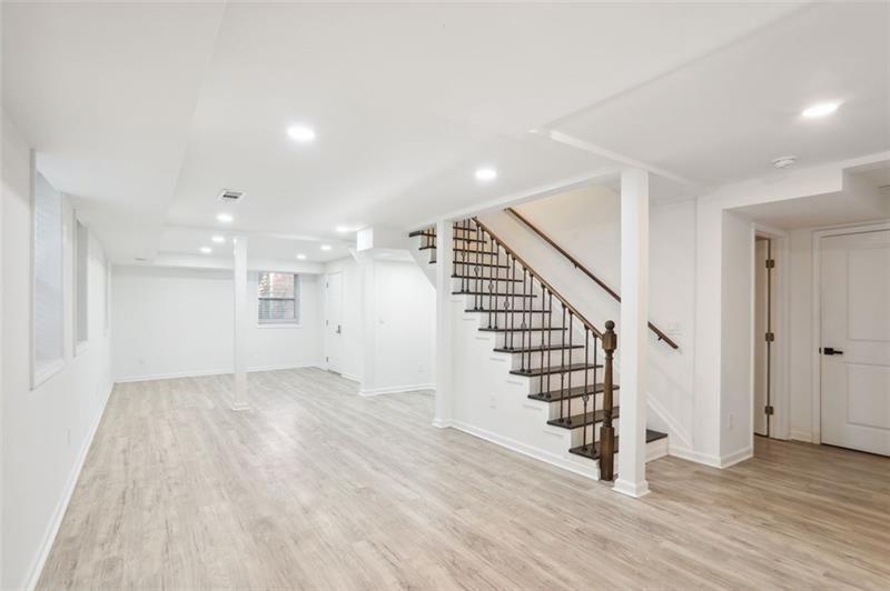 2533 Kelly Lake Road Decatur, GA 30032 - Photo 8 of 14 an empty room with wooden floor and windows