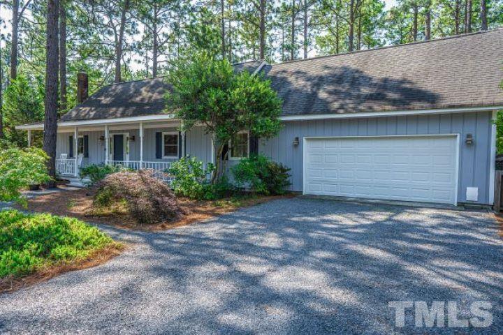 55 Rutledge Lane Pinehurst, NC 28374 - Photo 1 of 21 a house that has a tree in front of it