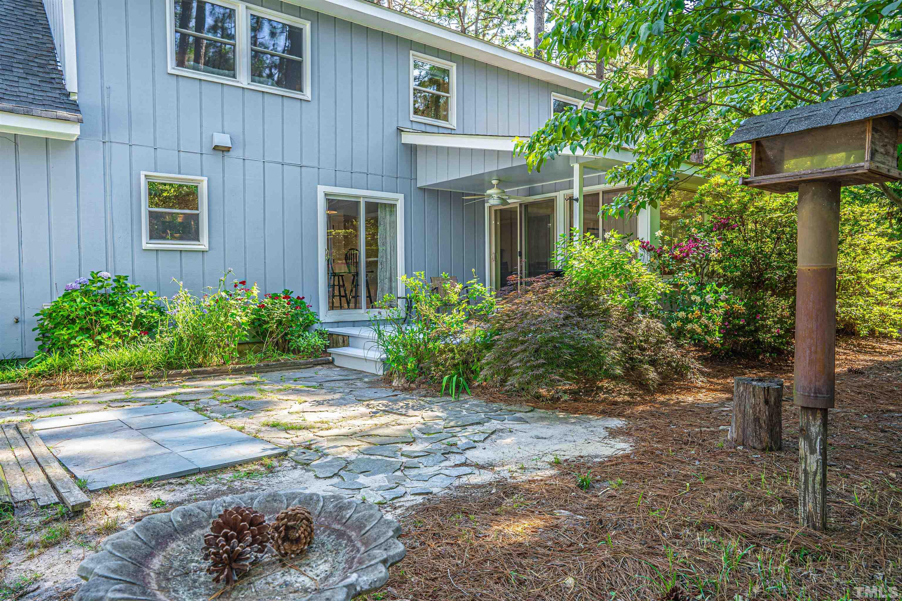 55 Rutledge Lane Pinehurst, NC 28374 - Photo 3 of 21 a front view of a house with garden