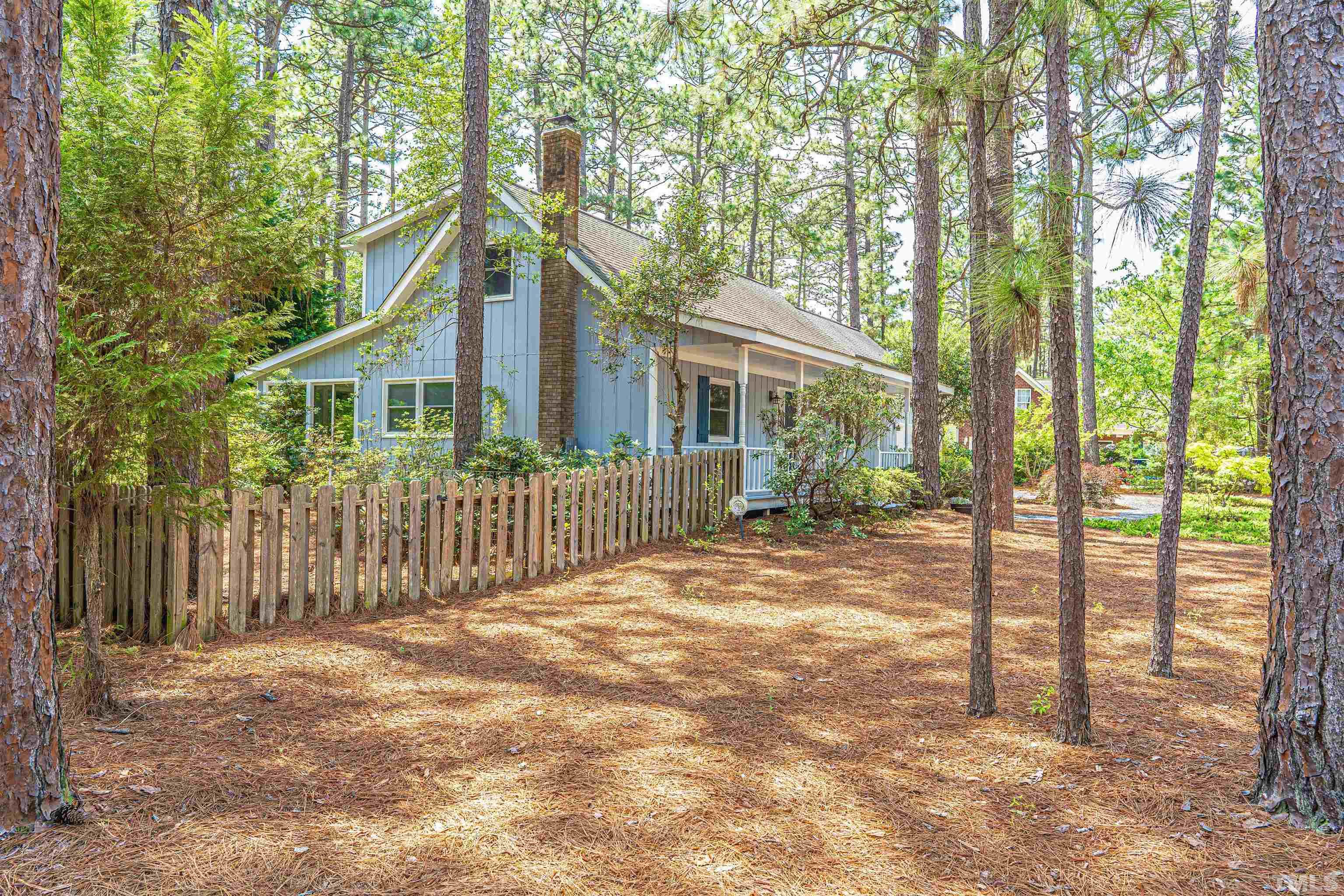55 Rutledge Lane Pinehurst, NC 28374 - Photo 4 of 21 a front view of a house with a garden