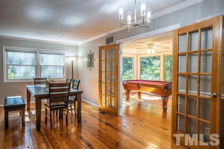 55 Rutledge Lane Pinehurst, NC 28374 - Photo 9 of 21 a view of a dining room with furniture window and wooden floor