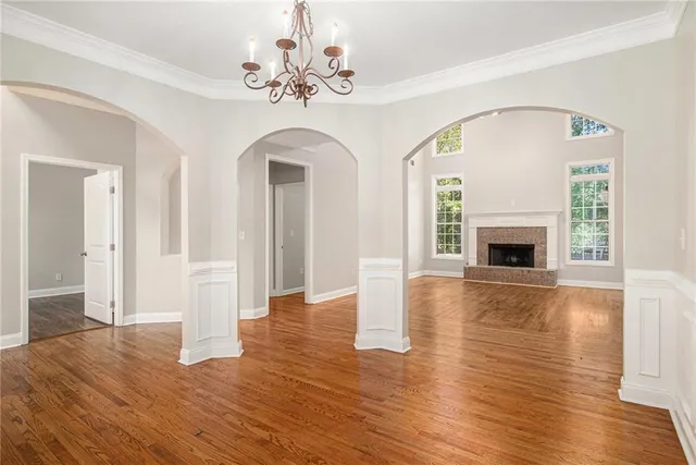 a view of an entryway with wooden floor