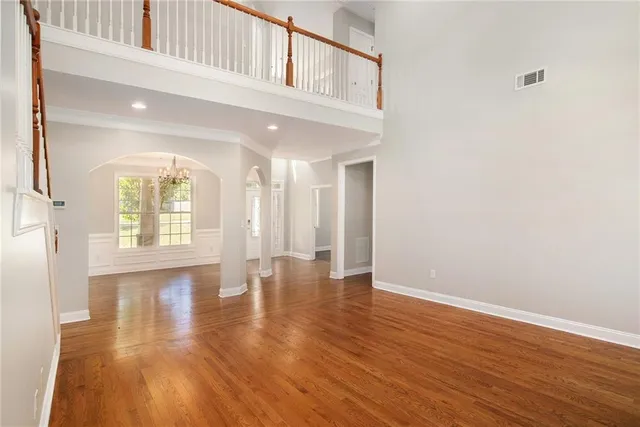 a view of an entryway with wooden floor