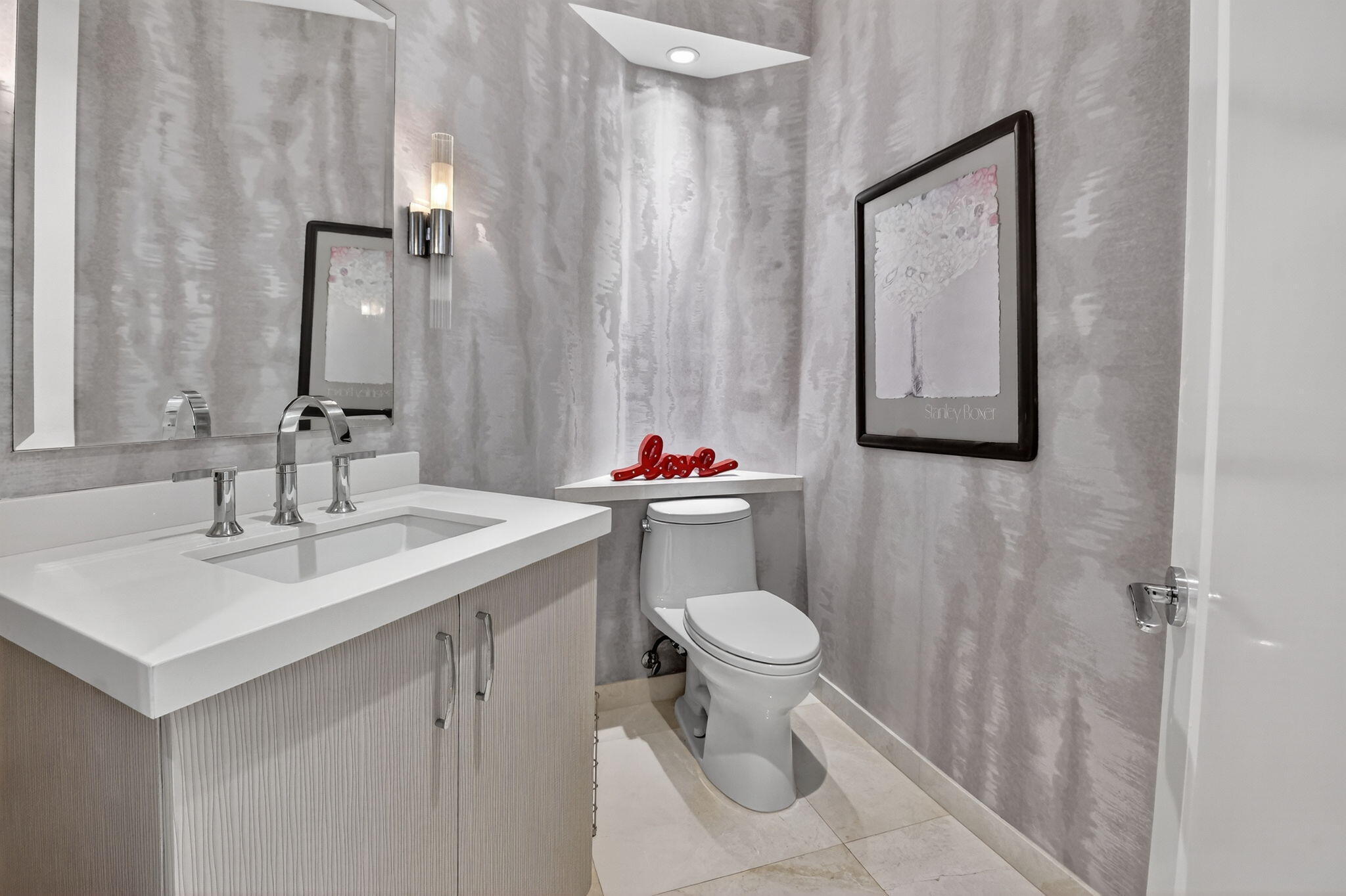 2563 Northwest 63rd Street Boca Raton, FL 33496 - Photo 23 of 65 a bathroom with a sink toilet and a mirror