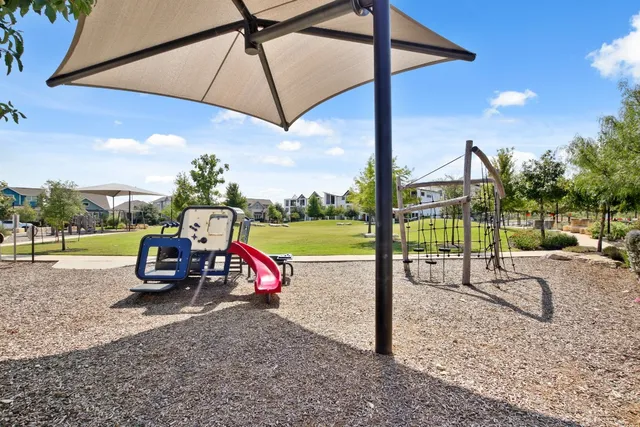 a view of a park with a slide