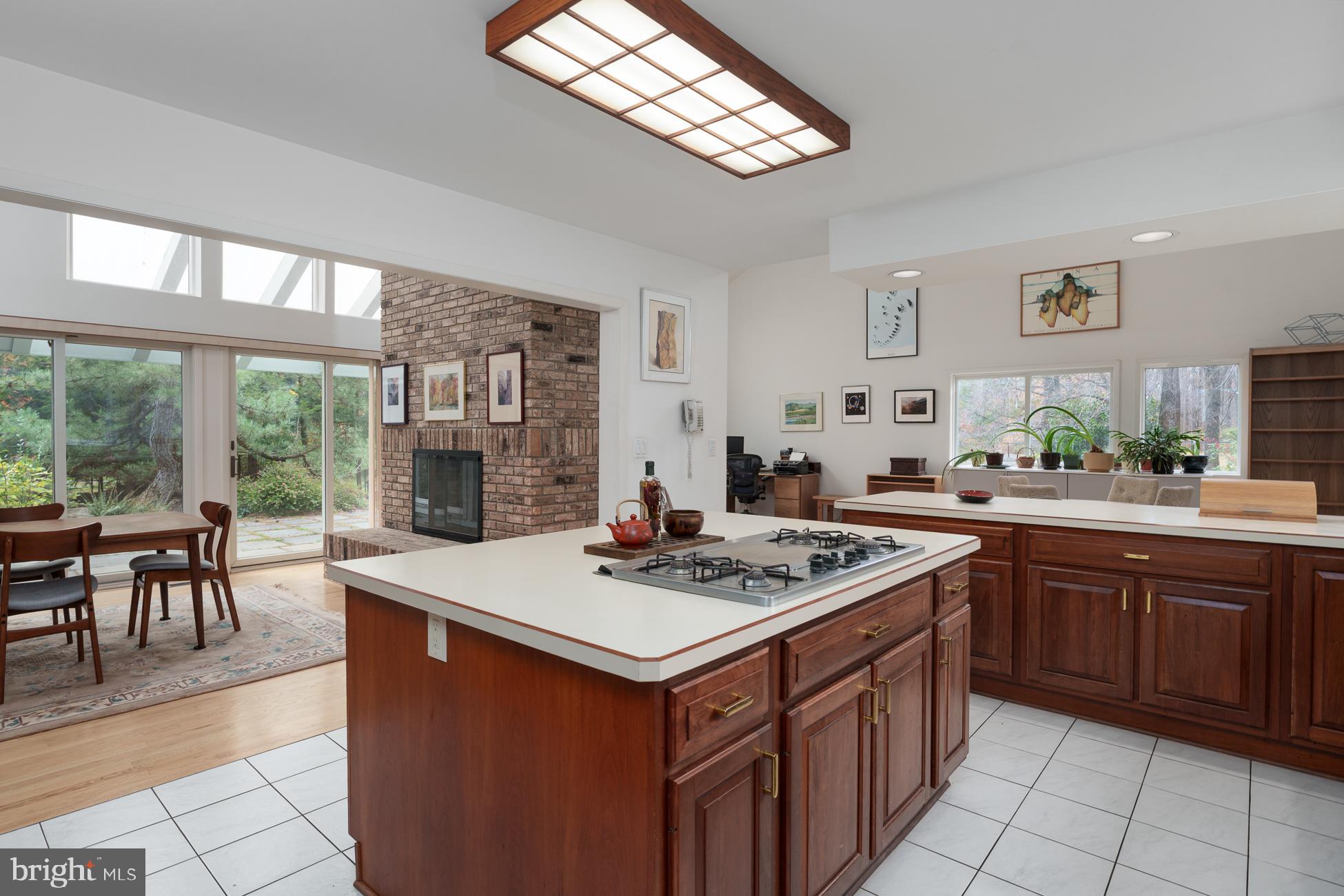 516 Mt Lucas Road Princeton, NJ 08540 - Photo 12 of 43 a kitchen that has a stove a table and chairs in it