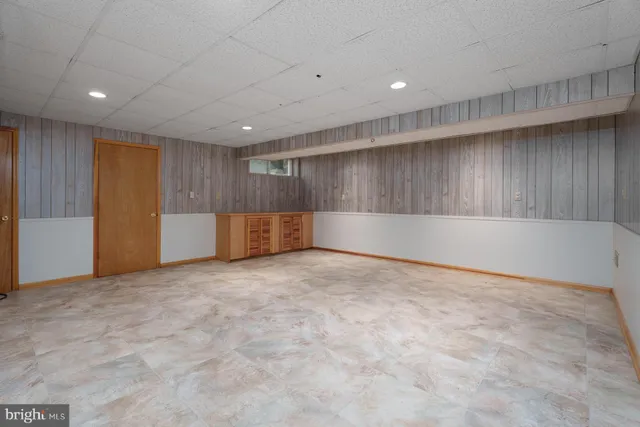 a bathroom with a toilet sink and shower