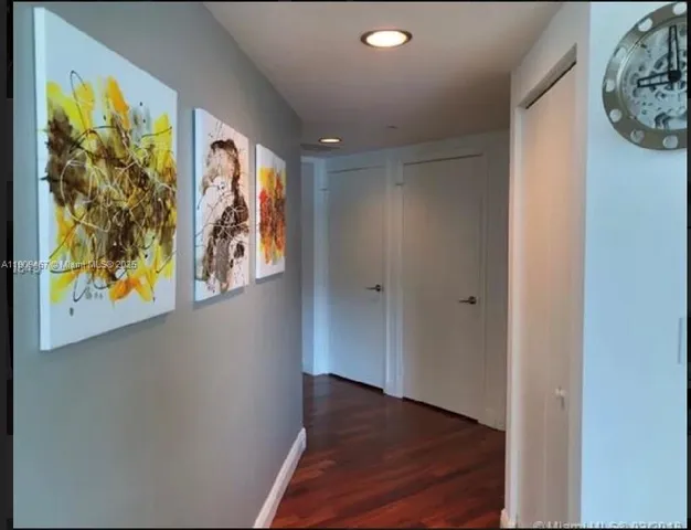 a bathroom with a granite countertop sink a toilet and bathtub