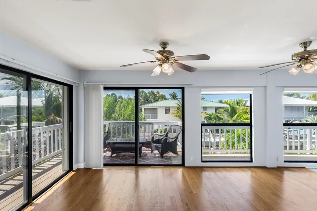 a kitchen with kitchen island granite countertop a sink appliances and cabinets