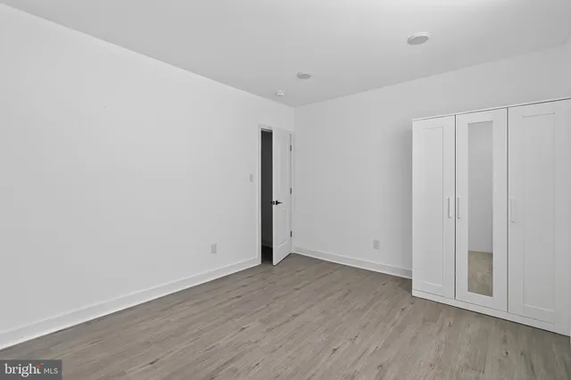 an empty room with wooden floor
