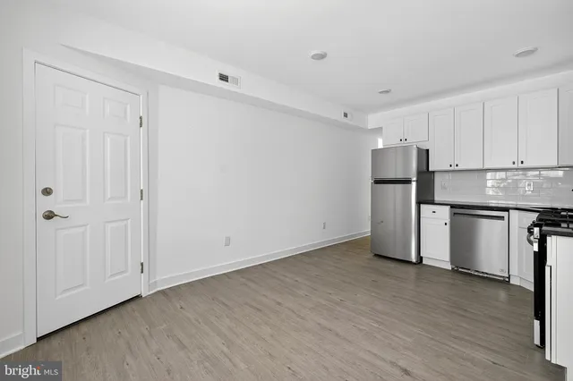 a view of kitchen with wooden floor