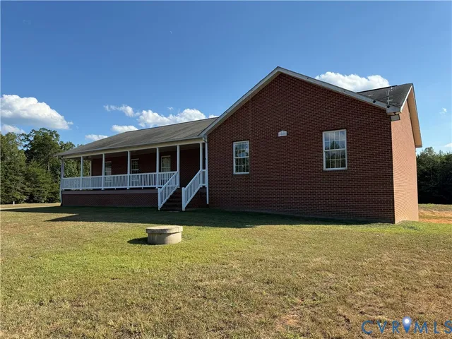 a house with swimming pool in front of it