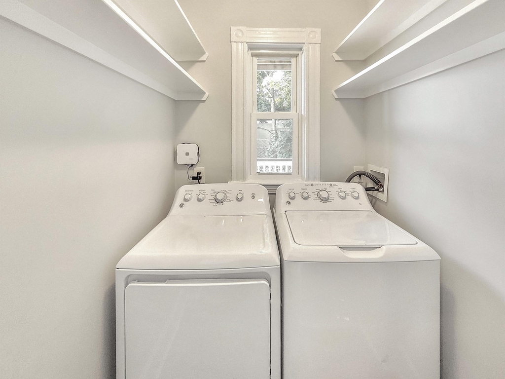 35 Dunlap Street, Unit 1 Boston, MA 02124 - Photo 6 of 7 a utility room with dryer and washer