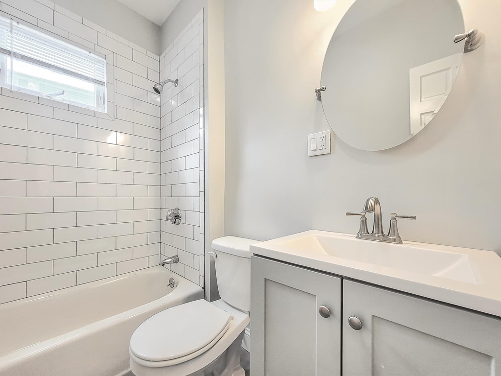 35 Dunlap Street, Unit 1 Boston, MA 02124 - Photo 7 of 7 a bathroom with a sink a toilet and shower