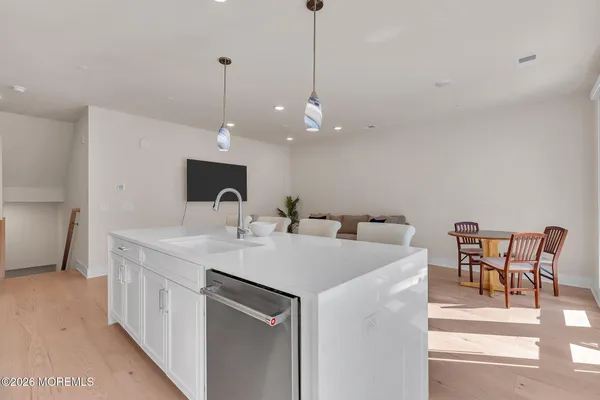 a kitchen with a sink and a microwave