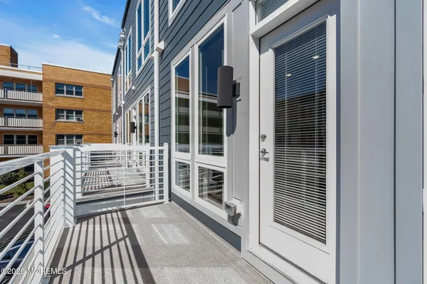 a view of a balcony with a floor to ceiling window