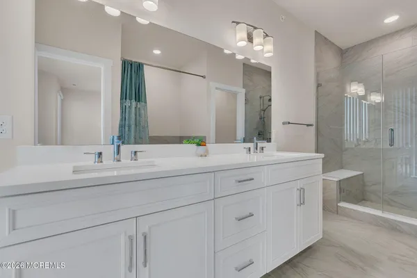 a bathroom with a bathtub and a shower