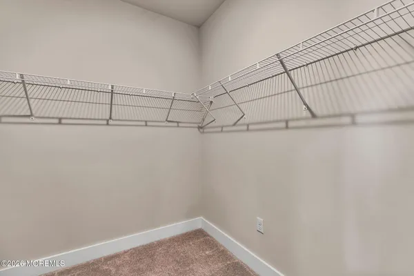 a view of a hallway with staircase