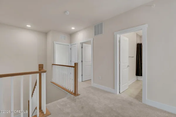 wooden floor with painting on the wall
