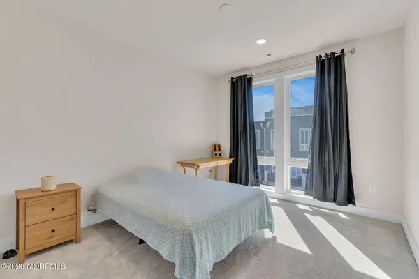 a bedroom with a bed and a cabinets