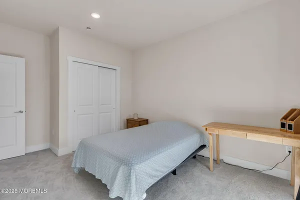 a bathroom with a double vanity sink toilet and shower
