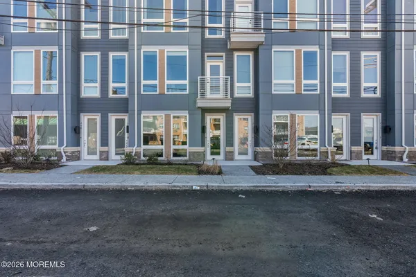 a view of a building with car parked