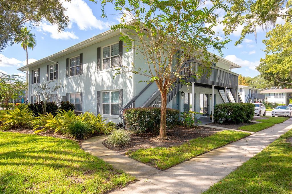 4822 South Conway Road, Unit 127 Orlando, FL 32812 - Photo 2 of 15 front view of a house with a yard