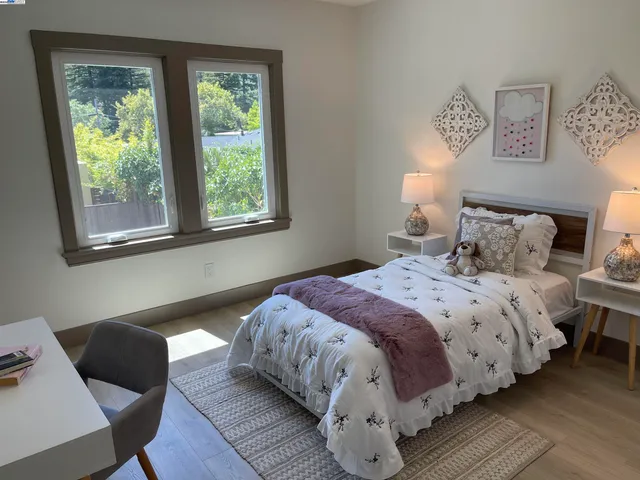 a bedroom with bed and a window