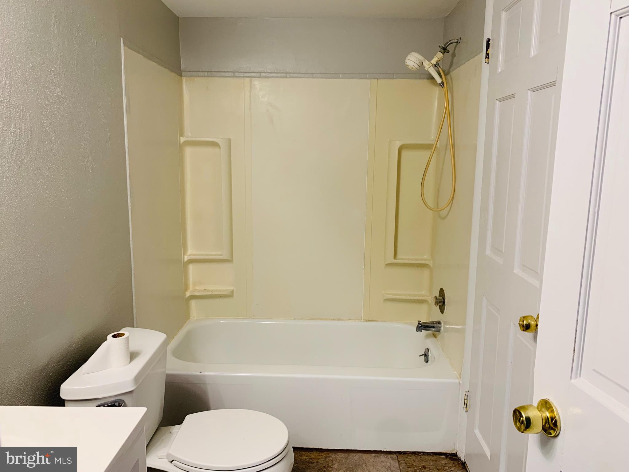 8875 Tamebird Court, Unit J Columbia, MD 21045 - Photo 13 of 15 a bathroom with a toilet and a bathtub