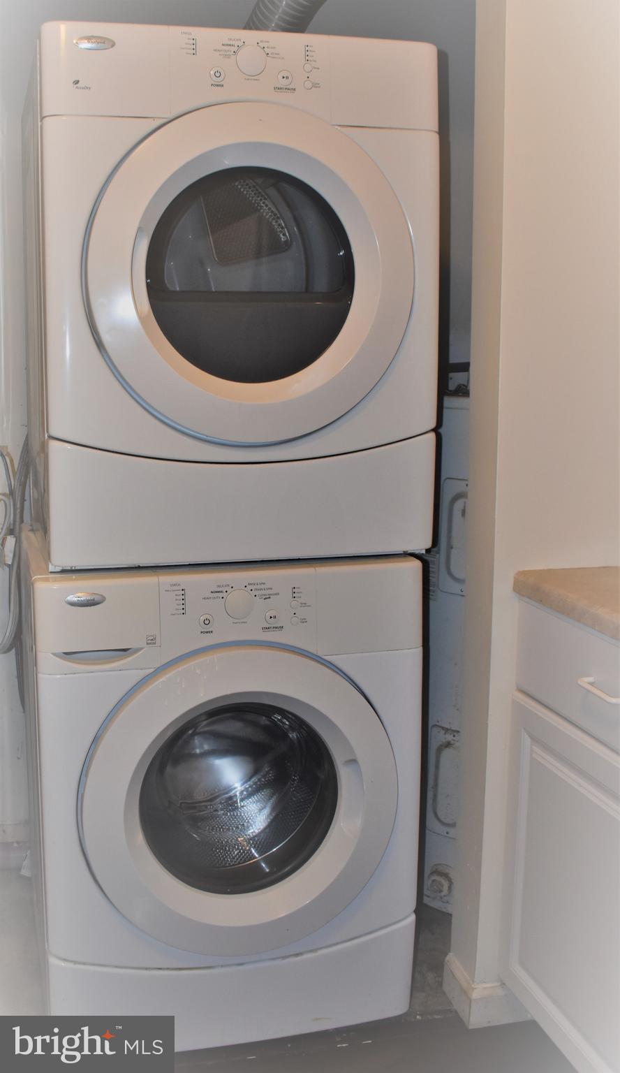 8875 Tamebird Court, Unit J Columbia, MD 21045 - Photo 15 of 15 a utility room with dryer and washer