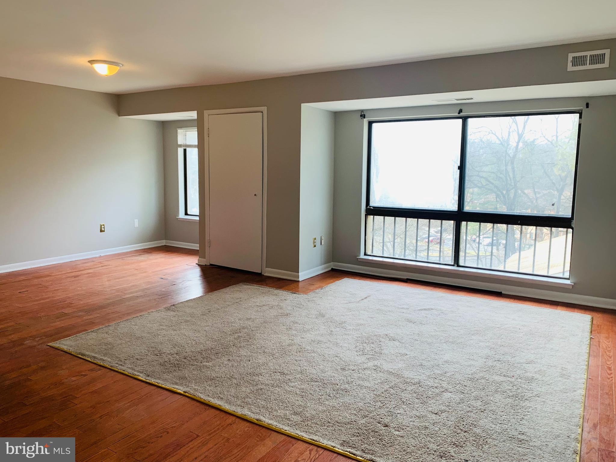 8875 Tamebird Court, Unit J Columbia, MD 21045 - Photo 7 of 15 an empty room with windows
