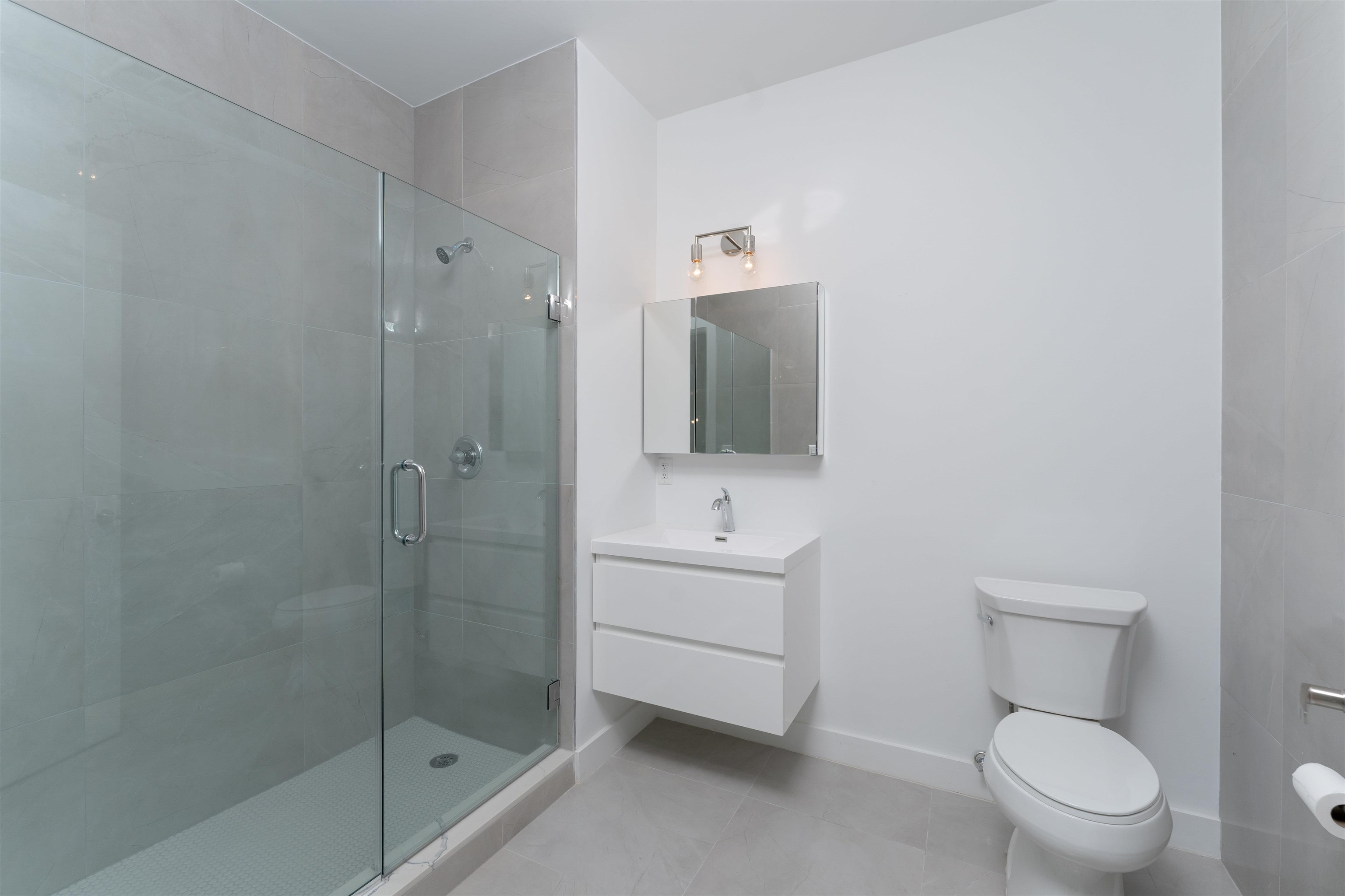 8621 River Road, Unit 3D North Bergen, NJ 07047 - Photo 11 of 22 a bathroom with a toilet a sink and shower