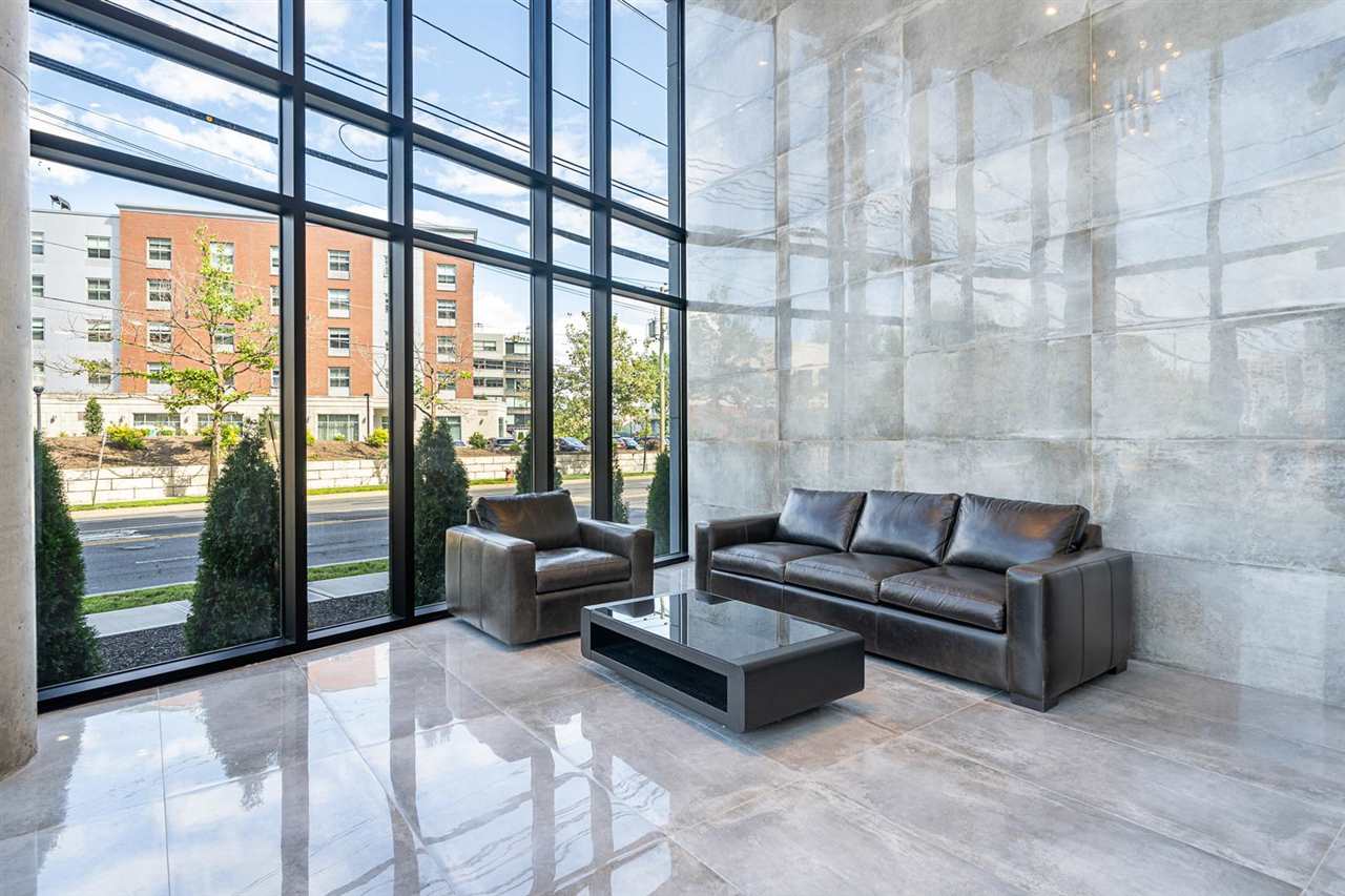 8621 River Road, Unit 3D North Bergen, NJ 07047 - Photo 19 of 22 a living room with furniture and a floor to ceiling window