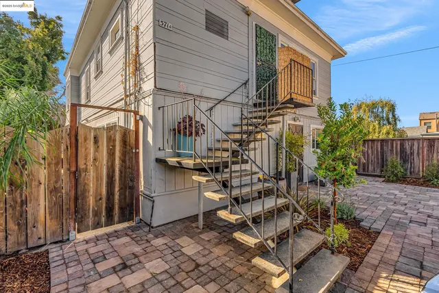 a view of a building with potted plants