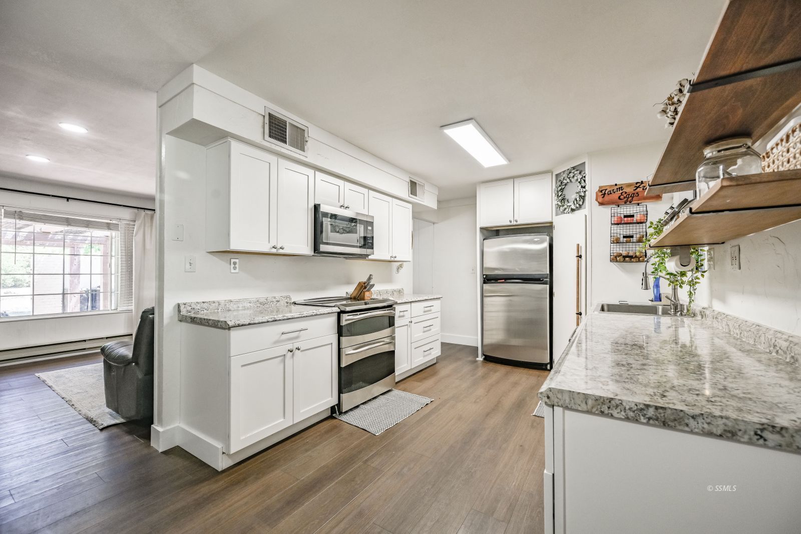1407 North Indian Wells Street Ridgecrest, CA 93555 - Photo 12 of 50 a kitchen with stainless steel appliances granite countertop a refrigerator a stove and a sink