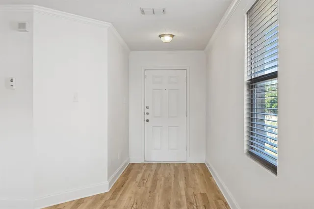 a view of a room that has a window in it