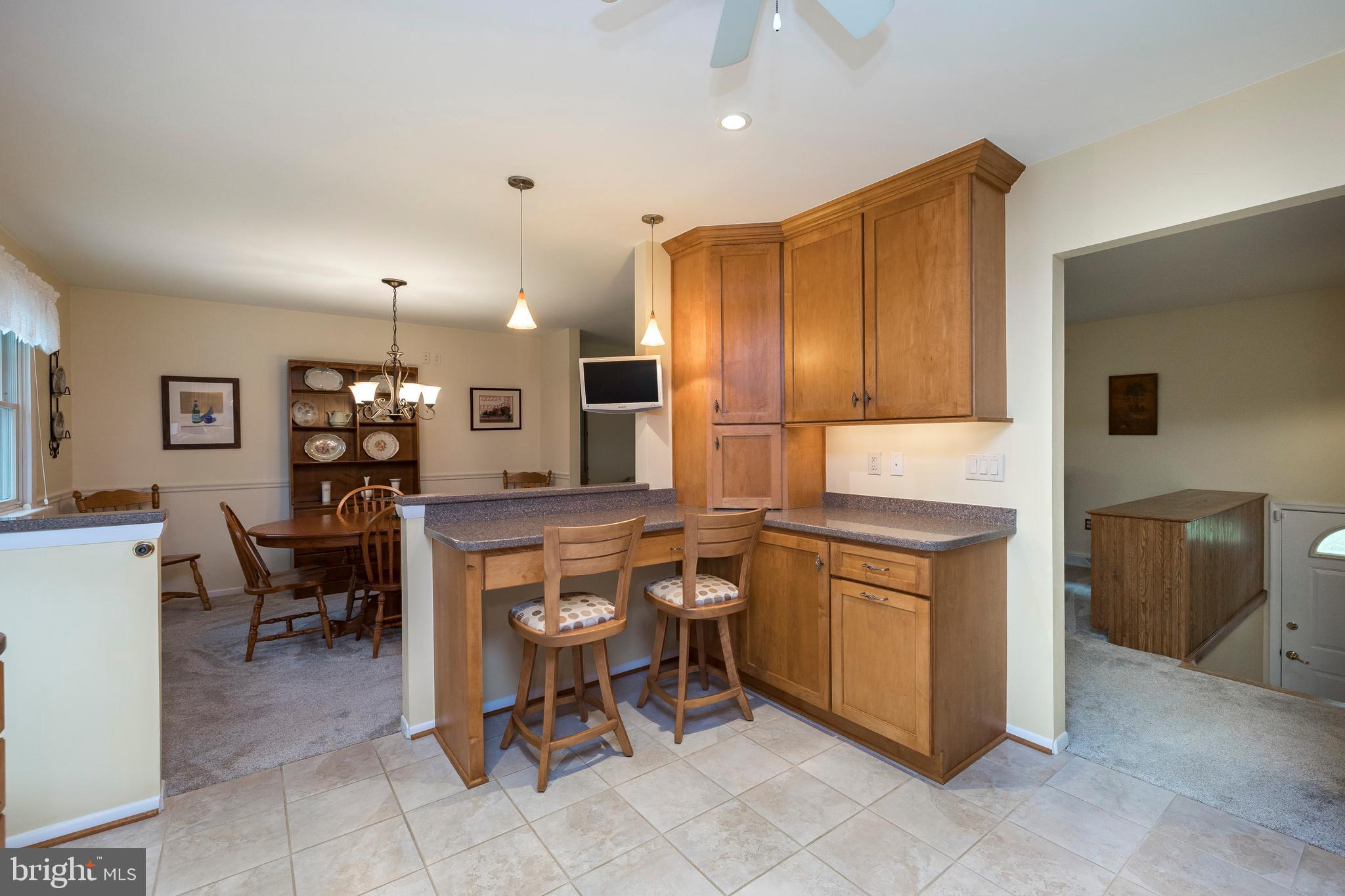 609 Spring Line Drive West Chester, PA 19382 - Photo 11 of 38 Cozy, casual dining bar and custom tile floor!