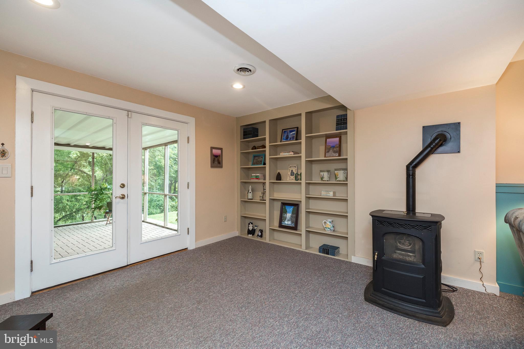 609 Spring Line Drive West Chester, PA 19382 - Photo 25 of 38 Built-ins, efficient pellet stove & doors to patio