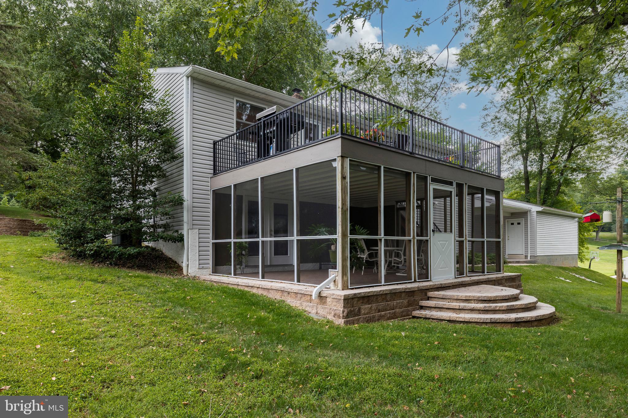 609 Spring Line Drive West Chester, PA 19382 - Photo 28 of 38 Exterior view of screened paver patio & deck!
